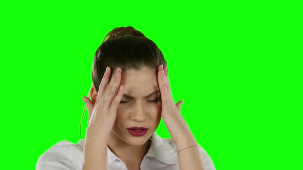 Young Businesswoman with Tired Eyes and Headache. Green Screen