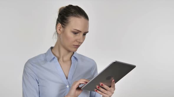 Young Businesswoman Excited for Success While Using Tablet