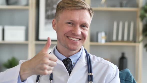Thumbs Up By Smiling Confident Doctor