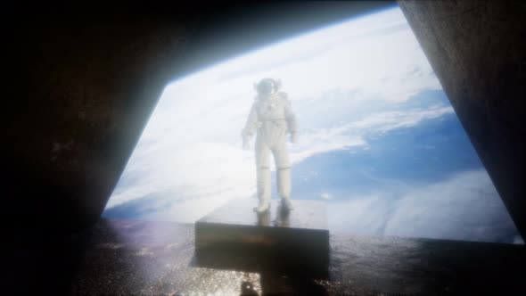 Astronaut on the Space Observatory Station Near Earth