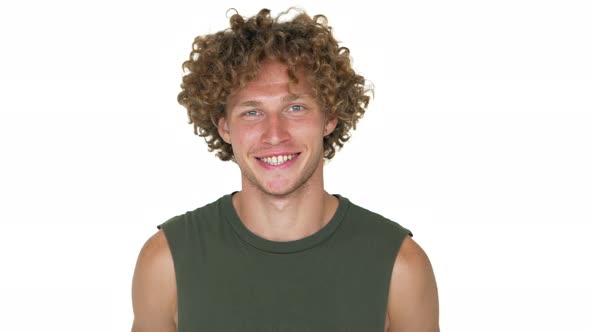 Picture of Young Blond Curly Man with Green Eyes Posing on Camera Smiling Showing OK Sign with