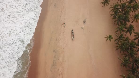 Drone view of people resting on a beach in Africa