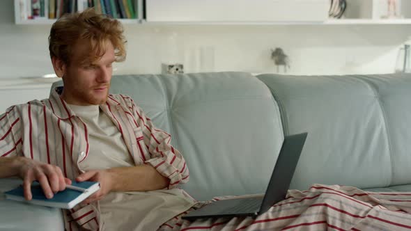 Businessman Studying Webinar Home in Pajamas Closeup