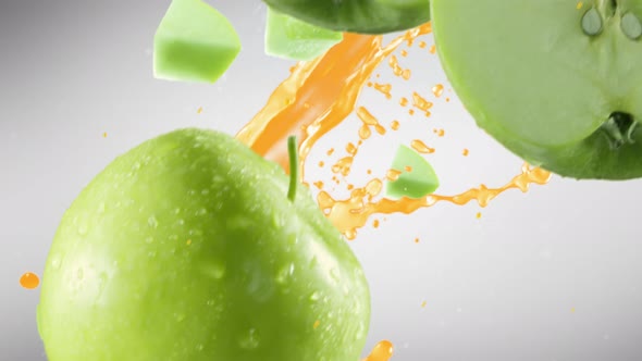 Green Apple with Slices Falling on Grey Background