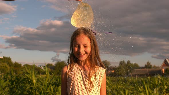 Water Balloon Splash On Little Head Of A Girl 4K