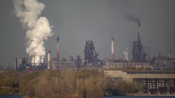 Industry Pipes Pollute the Atmosphere With Smoke