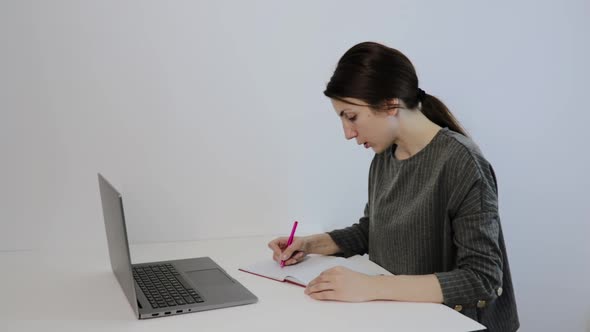 Woman Wears Conference Calling on Laptop Talks with Online Teacher Studying