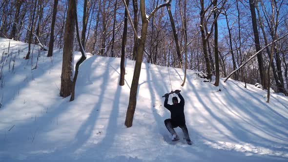 Guy Does Cool Trick Back Flip From Tree in Snowdrift