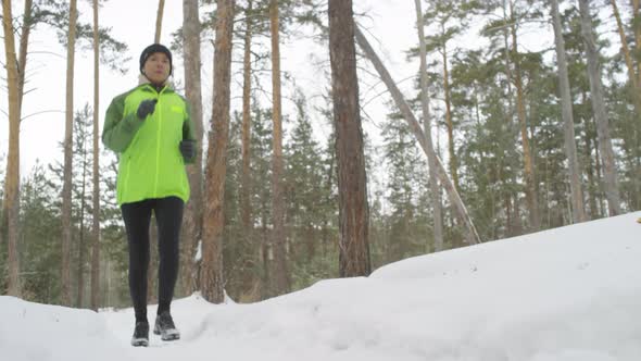 Active Woman Jogging in Winter
