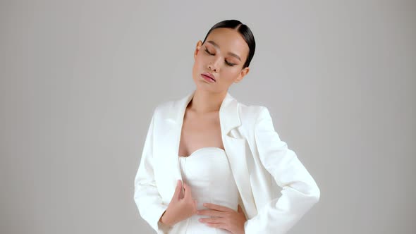 Beautiful modern look Asian businesswoman posing and looking at camera.