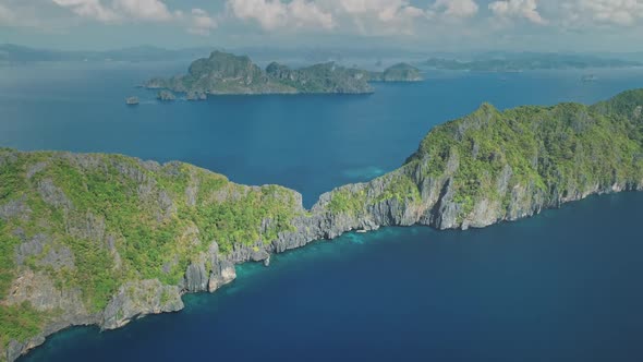 Mountainous Tropic Island at Ocean Bay Aerial Rise Up View