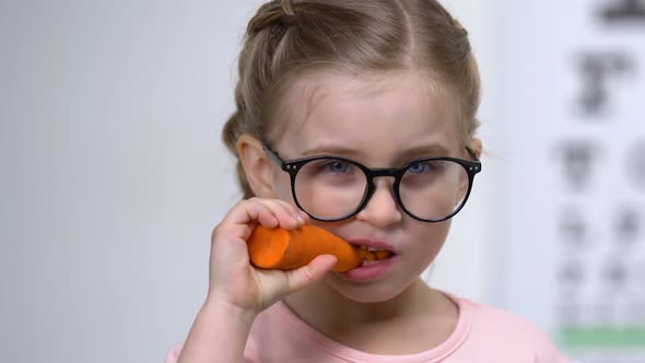 Cute Female Eyeglasses Biting Carrot, Food Improving Vision, Beta-Carotene