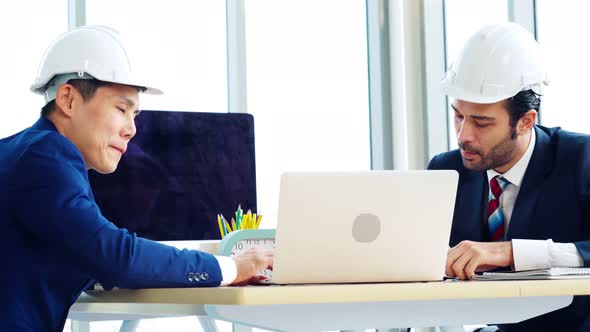 Engineer and Architect Meeting at Office Table