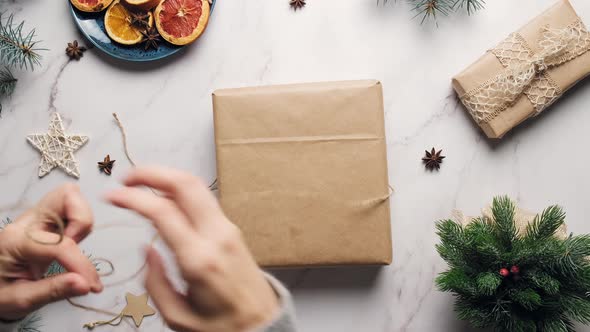 Woman Packaging Christmas Presents
