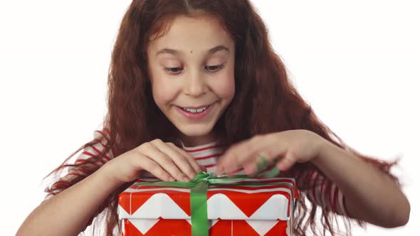 The Enthusiastic Girl Admires Her Gift