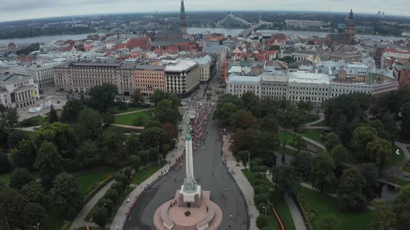 Aerial View on Crowd of People Who are Running a Marathon in Riga