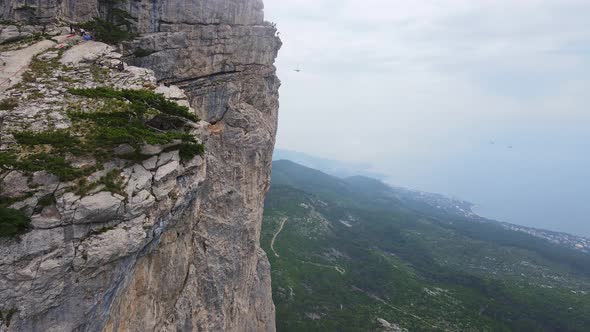 Extreme Jumping with a Rope From a Cliff
