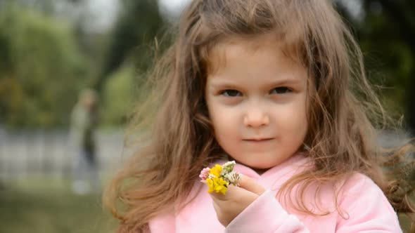 Little Girl Portrait with a Small Flower