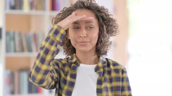 Portrait of Mixed Race Woman Looking Around Searching