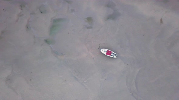 Boat On Shallow Water Of Gannel River In Newquay United Kingdom. - Aerial Ascending