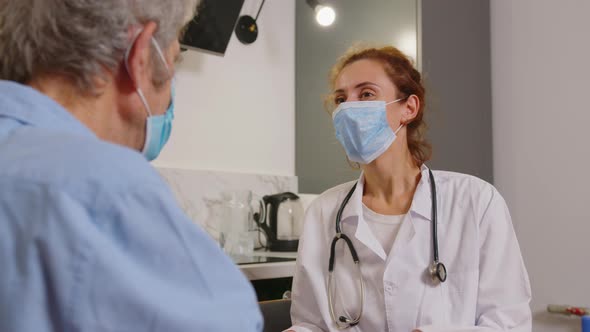 Health Visitor and a Senior Man During Home Visit