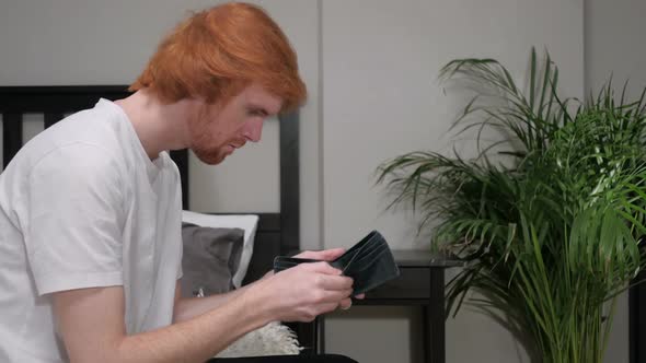 No Money in Wallet Gesture By Redhead Man