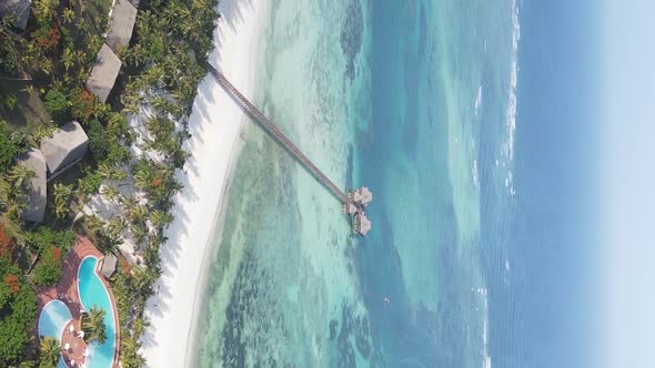 Vertical Video House on Stilts in the Ocean on the Coast of Zanzibar Tanzania Aerial View