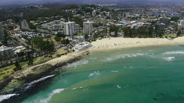 Beachside cityscape of Burleigh Heads, Gold Coast. Establishing aerial pan