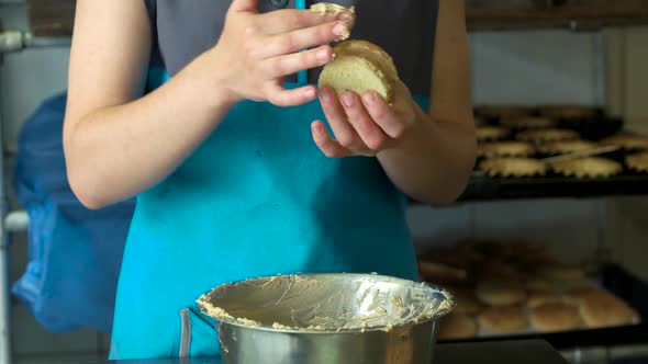 Female Worker Making Cookie at Bakery