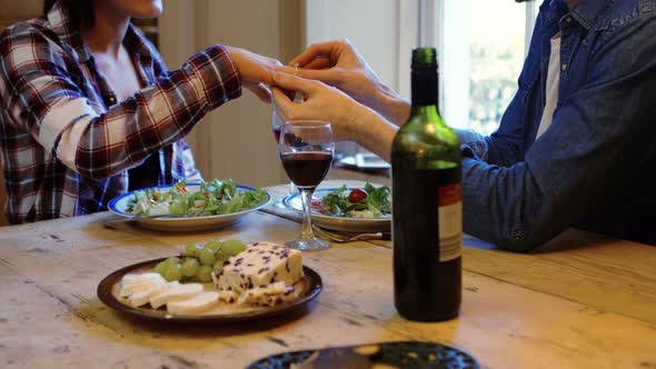 Man gifting finger ring to her woman