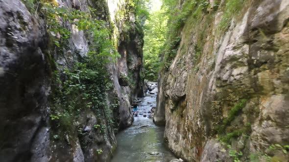 Man Walking Canyon River Aerial View