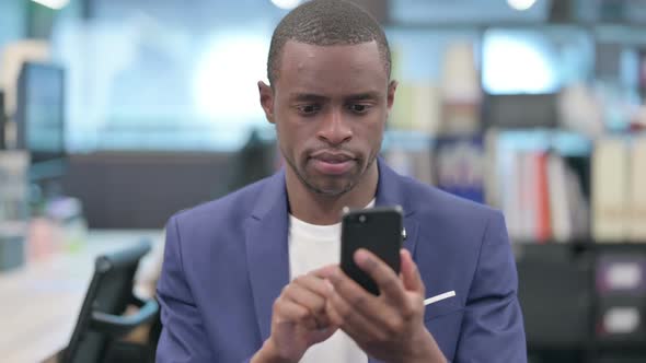 Portrait of African Businessman Using Smartphone