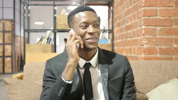 Black Businessman Talking On Smartphone