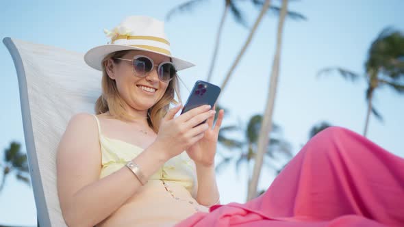Portrait Happy Traveler Woman Enjoy Success Mobile Phone at Luxury Beach Resort