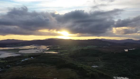 Flying Into the Sunrise Over a Peatbog in County Donegal - Ireland.