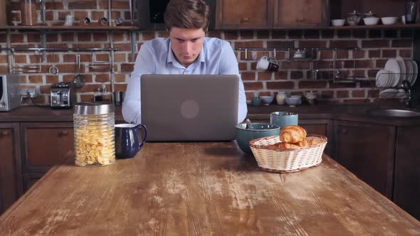 Student Has Breakfast and Scrolling Social Media