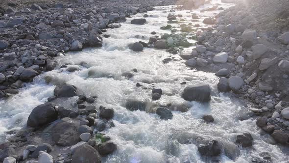 Mountain River Close Up Aerial View with the Splashes of the Water