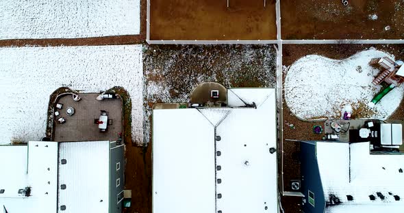 A late March snow has covered the rooftops of this small suburban neighborhood in March of 2019.  Fl