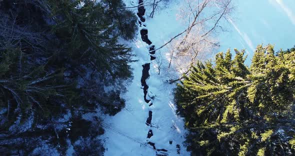 Aerial View Over Winter Season Frozen River Over Natural Landscape