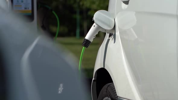 Charging White Electric Car