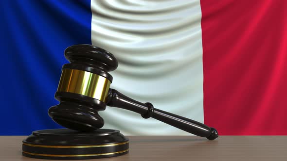 Judge's Gavel and Block Against the Flag of France