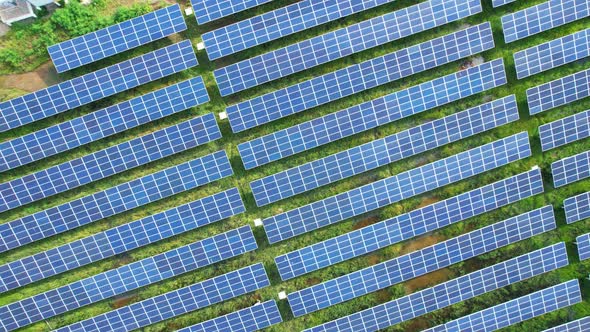 Drone fly over solar farm, renewable energy from solar.