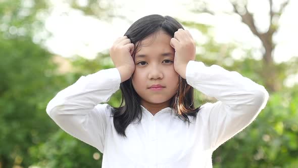 Close Up Portrait Asian Girl Stressed On Nature Background Slow Motion