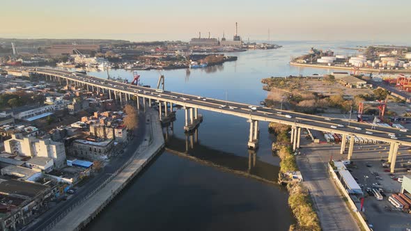 Static aerial of highway traffic on bridge over water in Buenos Aires