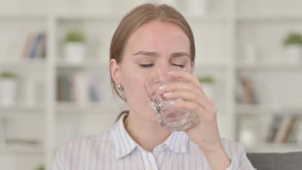 Portrait of Young Woman Having Toothache with Cold Water
