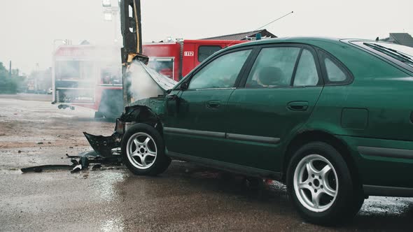 Smoke From Wrecked Car with Fire Engine in the Background. Car Accident. Dolly in