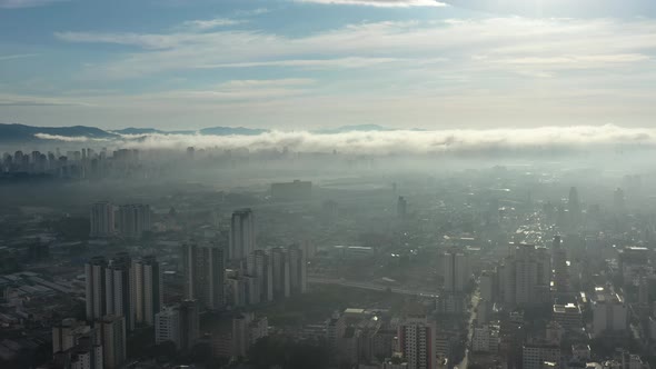 Fog morning at downtown district. Above the clouds.