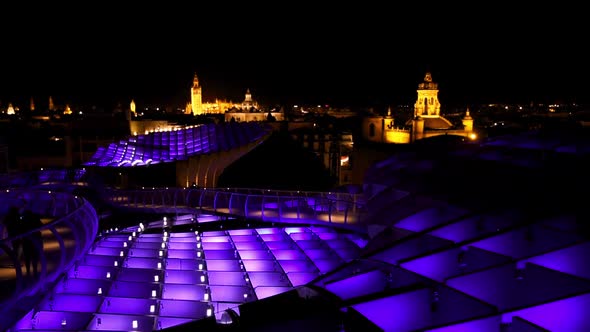 Magical nighttime illumination on the Setas de Sevilla. Aurora Experience and the skyline of Sevilla