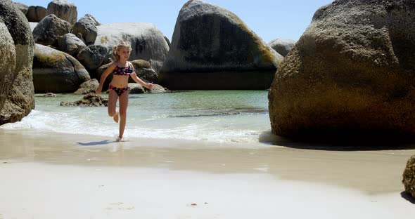 Girl running on water in the beach 4k