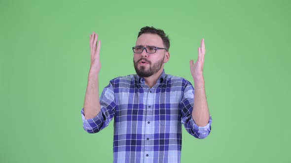 Happy Young Bearded Hipster Man Catching Something